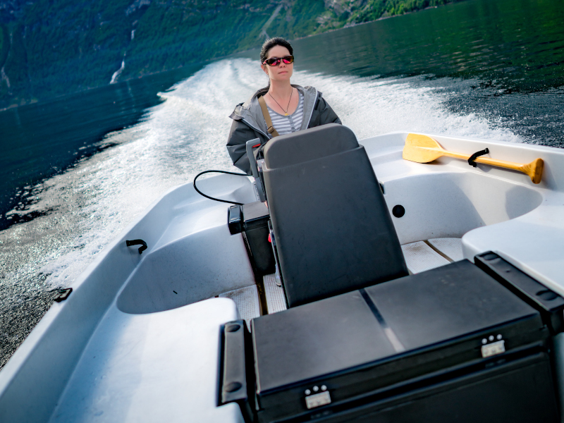 woman driving a boat